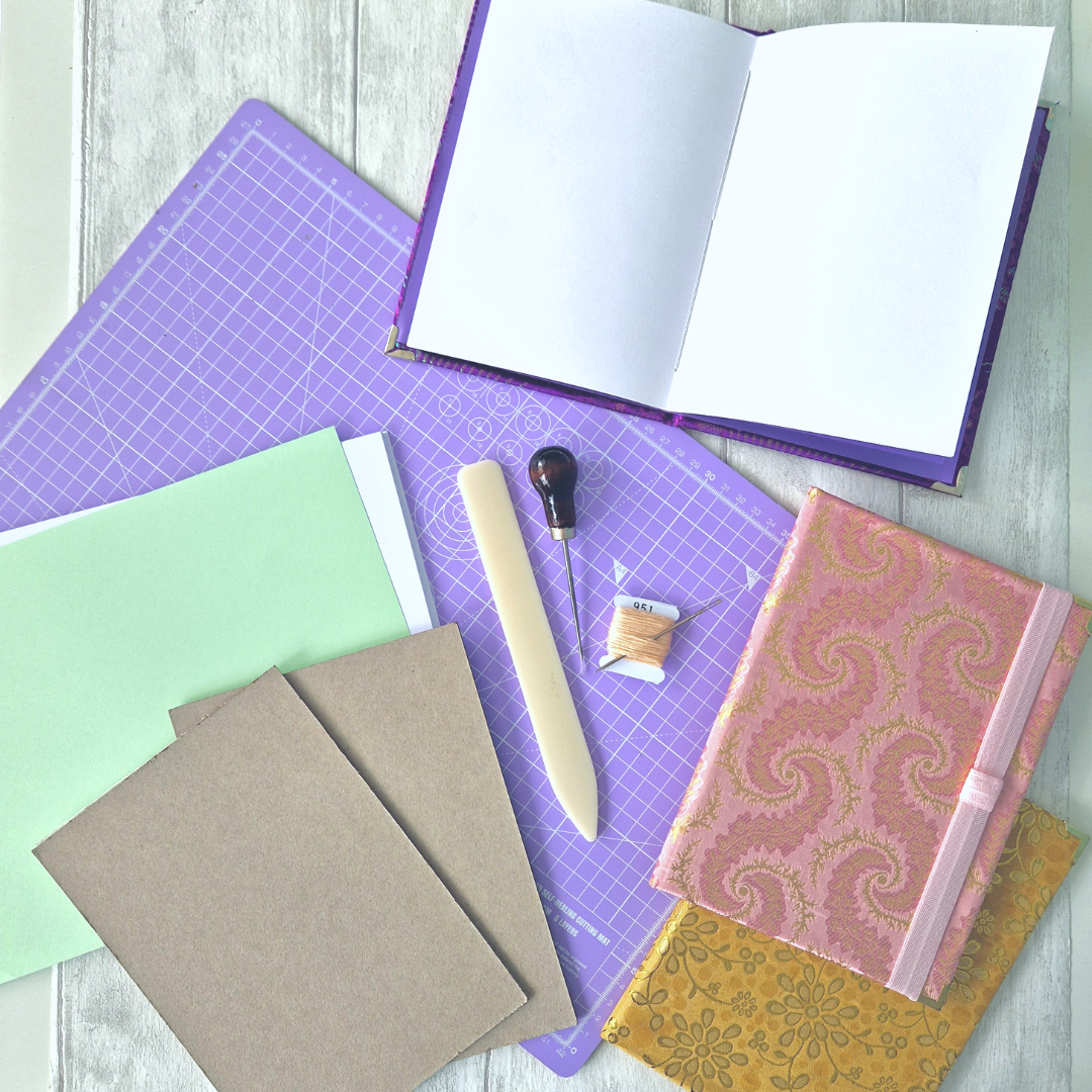 A flatlay image of book binding materials